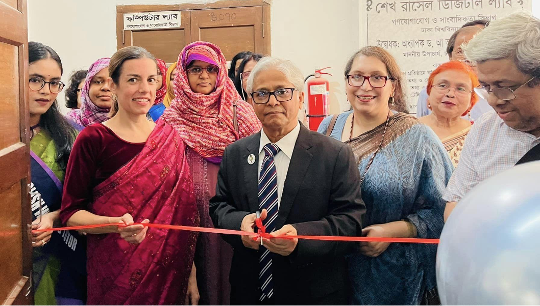 an image of writing center inauguration with people gathering and cutting the ribbon